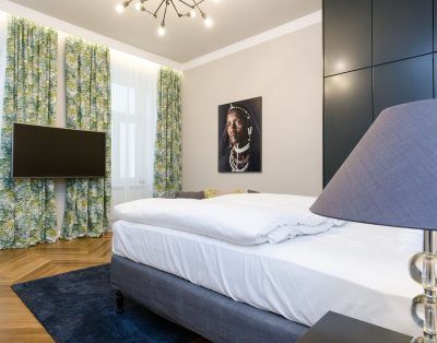 Stylish Dark-Toned Studio with Designer Touches